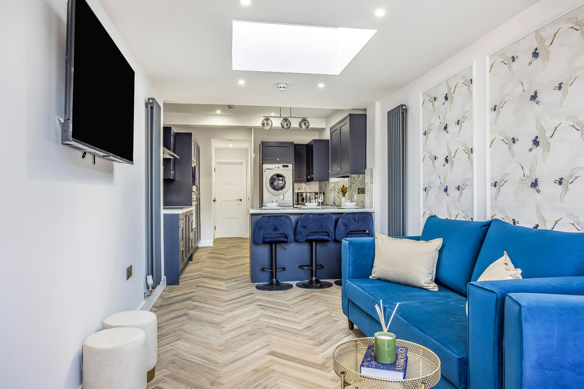 Refurbished HMO living space and kitchen completed by SODA Building Services Ltd
